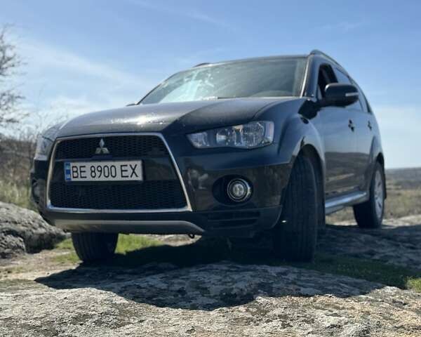 Чорний Міцубісі Аутлендер, об'ємом двигуна 2.4 л та пробігом 187 тис. км за 10200 $, фото 1 на Automoto.ua