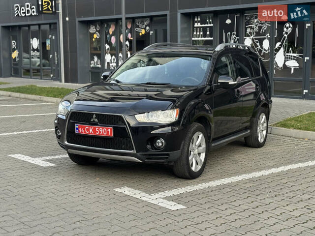 Черный Мицубиси Аутлендер, объемом двигателя 2.2 л и пробегом 225 тыс. км за 10950 $, фото 1 на Automoto.ua