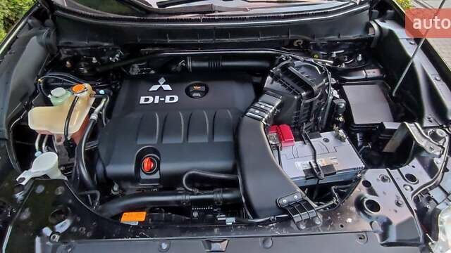 Черный Мицубиси Аутлендер, объемом двигателя 2 л и пробегом 210 тыс. км за 10600 $, фото 31 на Automoto.ua