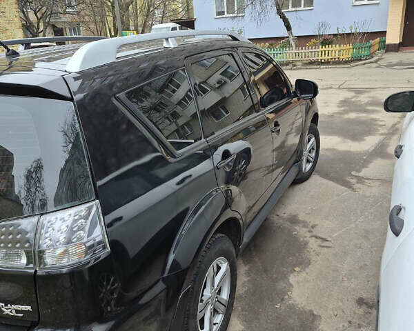 Черный Мицубиси Аутлендер, объемом двигателя 2.4 л и пробегом 198 тыс. км за 10500 $, фото 4 на Automoto.ua