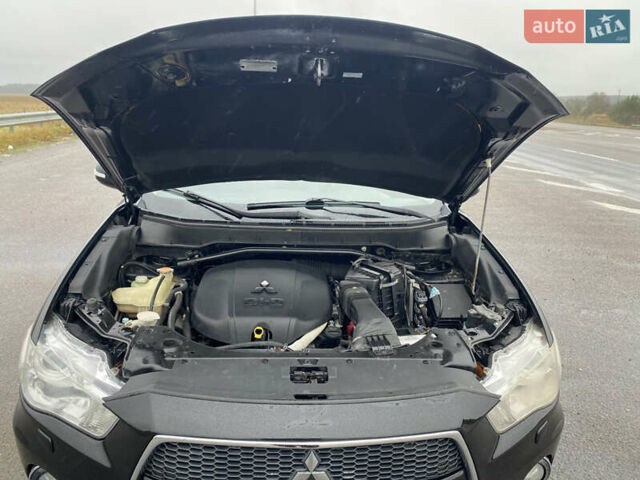 Черный Мицубиси Аутлендер, объемом двигателя 2.2 л и пробегом 227 тыс. км за 10700 $, фото 42 на Automoto.ua