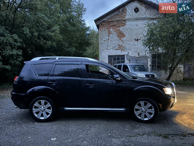 Чорний Міцубісі Аутлендер, об'ємом двигуна 2 л та пробігом 258 тис. км за 8699 $, фото 15 на Automoto.ua