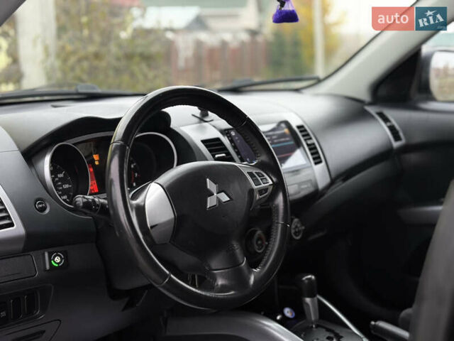 Черный Мицубиси Аутлендер, объемом двигателя 2.4 л и пробегом 184 тыс. км за 10800 $, фото 5 на Automoto.ua