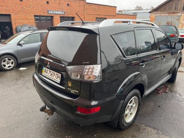 Черный Мицубиси Аутлендер, объемом двигателя 2.4 л и пробегом 305 тыс. км за 10000 $, фото 2 на Automoto.ua