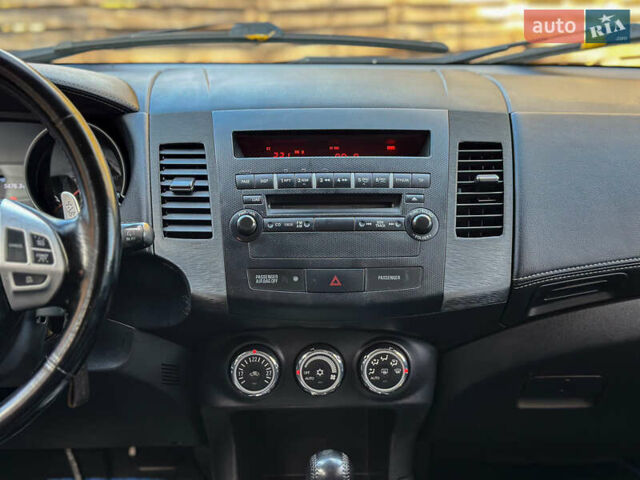 Черный Мицубиси Аутлендер, объемом двигателя 2.2 л и пробегом 226 тыс. км за 11500 $, фото 85 на Automoto.ua