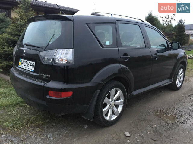 Черный Мицубиси Аутлендер, объемом двигателя 2.36 л и пробегом 315 тыс. км за 9700 $, фото 3 на Automoto.ua