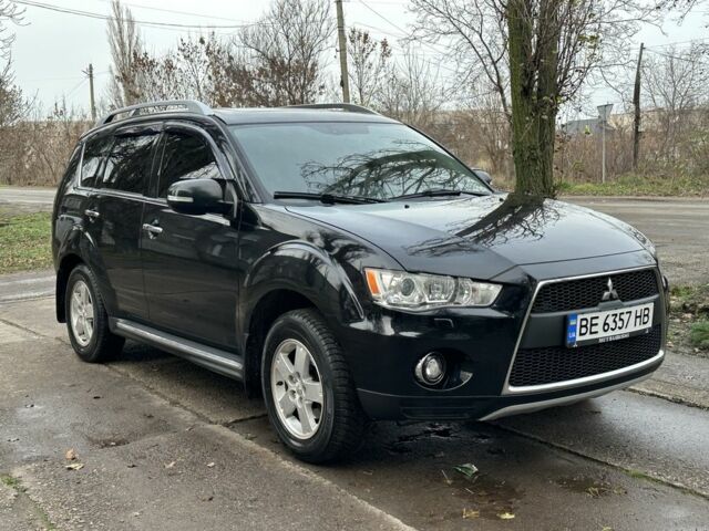 Черный Мицубиси Аутлендер, объемом двигателя 2.4 л и пробегом 197 тыс. км за 11300 $, фото 1 на Automoto.ua