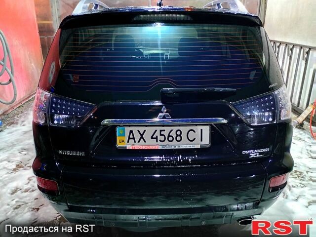 Черный Мицубиси Аутлендер, объемом двигателя 2.4 л и пробегом 70 тыс. км за 10500 $, фото 4 на Automoto.ua
