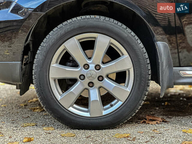 Черный Мицубиси Аутлендер, объемом двигателя 2.2 л и пробегом 226 тыс. км за 11500 $, фото 58 на Automoto.ua