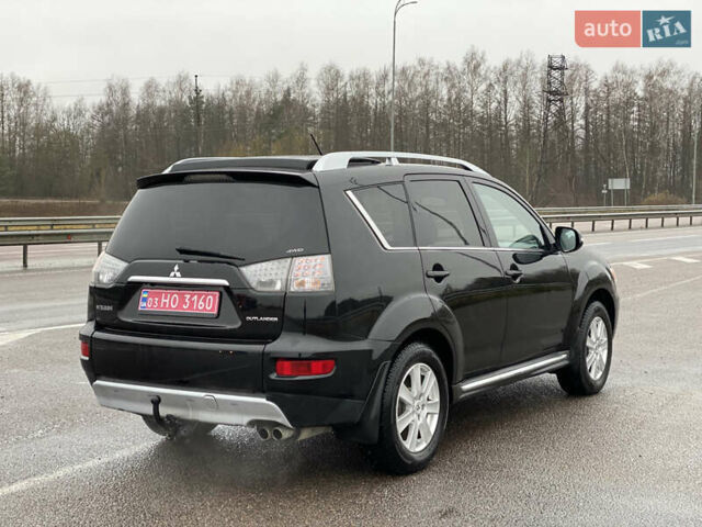 Черный Мицубиси Аутлендер, объемом двигателя 2.2 л и пробегом 227 тыс. км за 10700 $, фото 3 на Automoto.ua