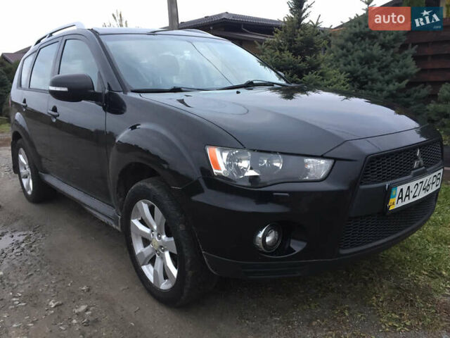 Черный Мицубиси Аутлендер, объемом двигателя 2.36 л и пробегом 315 тыс. км за 9700 $, фото 1 на Automoto.ua