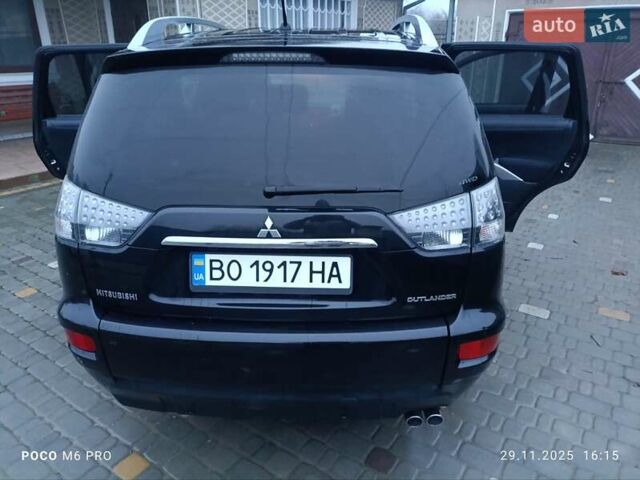 Черный Мицубиси Аутлендер, объемом двигателя 2.2 л и пробегом 225 тыс. км за 11500 $, фото 1 на Automoto.ua