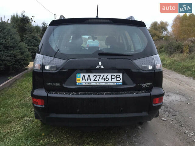 Черный Мицубиси Аутлендер, объемом двигателя 2.36 л и пробегом 315 тыс. км за 9700 $, фото 6 на Automoto.ua