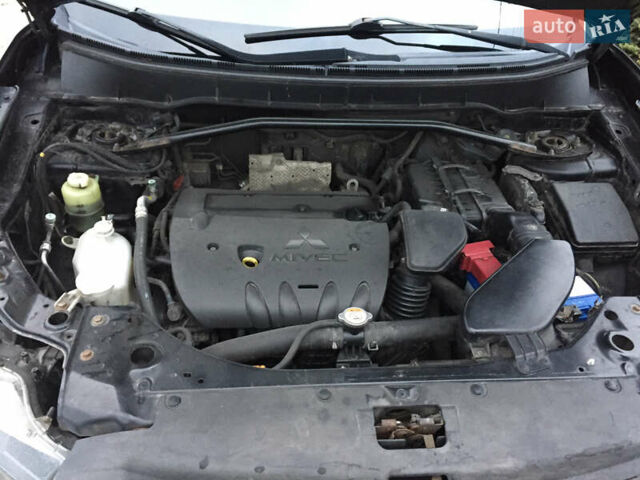 Черный Мицубиси Аутлендер, объемом двигателя 2.36 л и пробегом 315 тыс. км за 9700 $, фото 20 на Automoto.ua