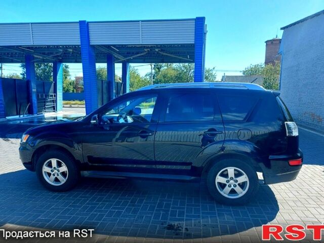 Чорний Міцубісі Аутлендер, об'ємом двигуна 2 л та пробігом 291 тис. км за 11200 $, фото 1 на Automoto.ua