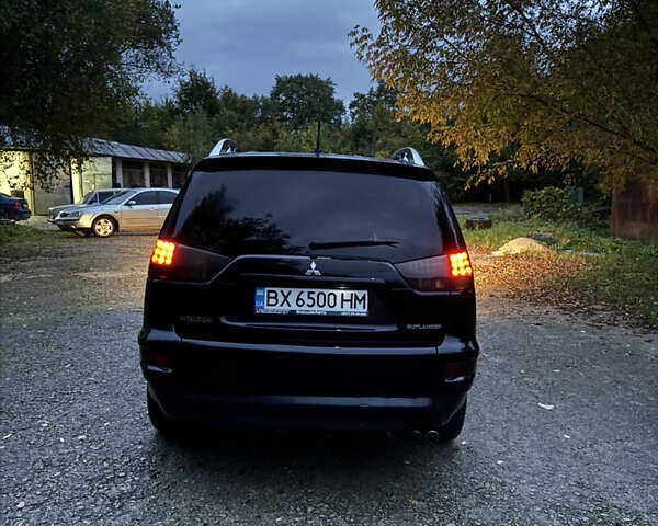 Чорний Міцубісі Аутлендер, об'ємом двигуна 2 л та пробігом 258 тис. км за 8699 $, фото 17 на Automoto.ua