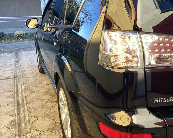 Черный Мицубиси Аутлендер, объемом двигателя 1.97 л и пробегом 292 тыс. км за 10900 $, фото 14 на Automoto.ua