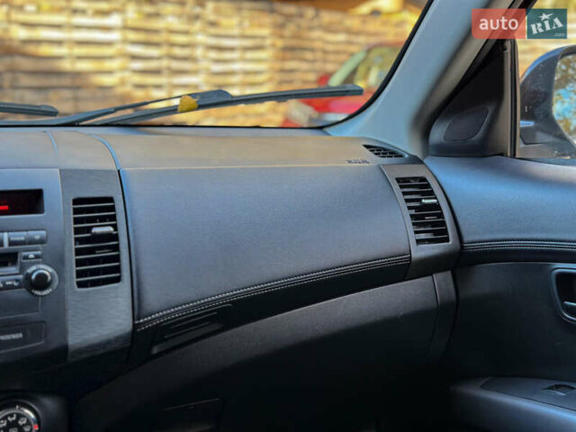 Черный Мицубиси Аутлендер, объемом двигателя 2.2 л и пробегом 226 тыс. км за 11500 $, фото 86 на Automoto.ua