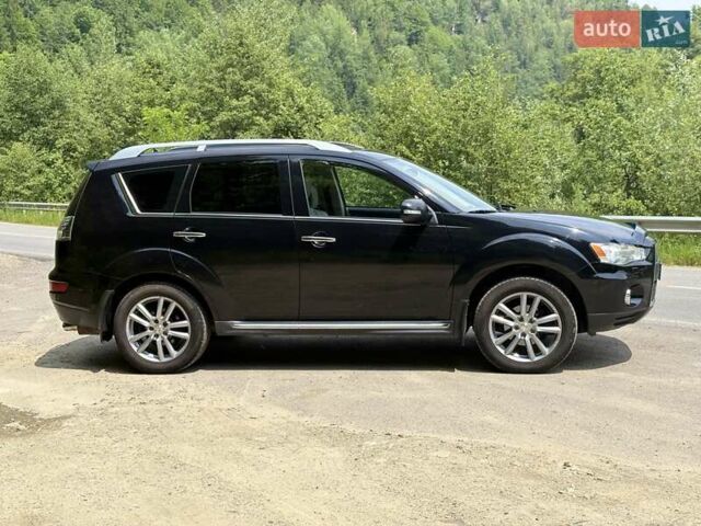 Черный Мицубиси Аутлендер, объемом двигателя 2.4 л и пробегом 275 тыс. км за 12000 $, фото 2 на Automoto.ua