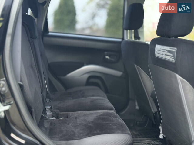 Черный Мицубиси Аутлендер, объемом двигателя 2.4 л и пробегом 184 тыс. км за 10800 $, фото 10 на Automoto.ua