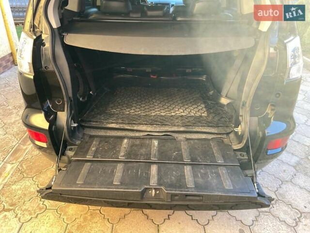 Черный Мицубиси Аутлендер, объемом двигателя 1.97 л и пробегом 292 тыс. км за 10900 $, фото 1 на Automoto.ua