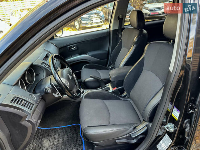 Черный Мицубиси Аутлендер, объемом двигателя 2.2 л и пробегом 226 тыс. км за 11500 $, фото 63 на Automoto.ua