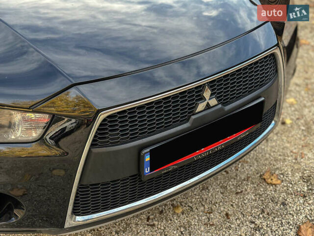 Черный Мицубиси Аутлендер, объемом двигателя 2.2 л и пробегом 226 тыс. км за 11500 $, фото 44 на Automoto.ua
