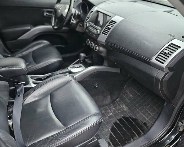 Чорний Міцубісі Аутлендер, об'ємом двигуна 2.4 л та пробігом 70 тис. км за 13000 $, фото 11 на Automoto.ua