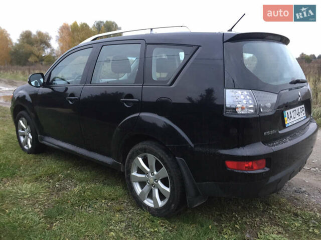 Черный Мицубиси Аутлендер, объемом двигателя 2.36 л и пробегом 315 тыс. км за 9700 $, фото 4 на Automoto.ua