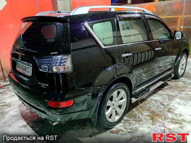 Черный Мицубиси Аутлендер, объемом двигателя 2.4 л и пробегом 70 тыс. км за 10500 $, фото 3 на Automoto.ua