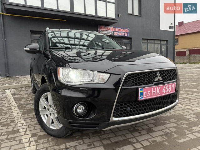 Черный Мицубиси Аутлендер, объемом двигателя 2.2 л и пробегом 257 тыс. км за 11000 $, фото 125 на Automoto.ua
