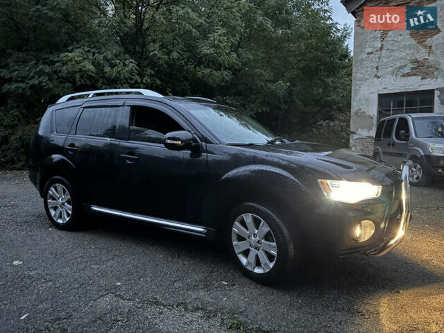 Чорний Міцубісі Аутлендер, об'ємом двигуна 2 л та пробігом 258 тис. км за 8699 $, фото 14 на Automoto.ua
