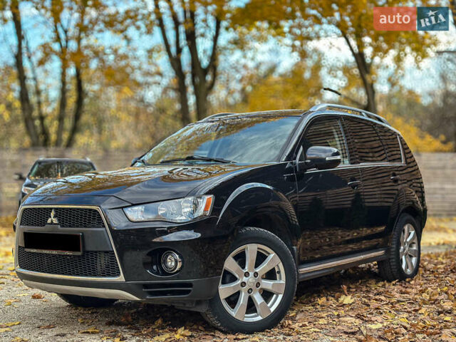 Черный Мицубиси Аутлендер, объемом двигателя 2.2 л и пробегом 226 тыс. км за 11500 $, фото 1 на Automoto.ua