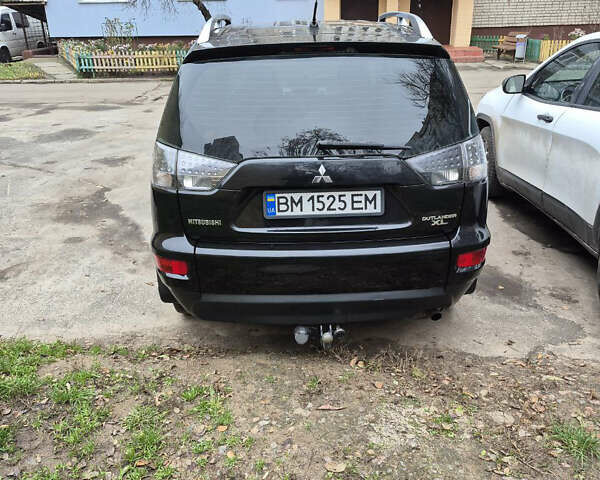 Черный Мицубиси Аутлендер, объемом двигателя 2.4 л и пробегом 198 тыс. км за 10500 $, фото 3 на Automoto.ua