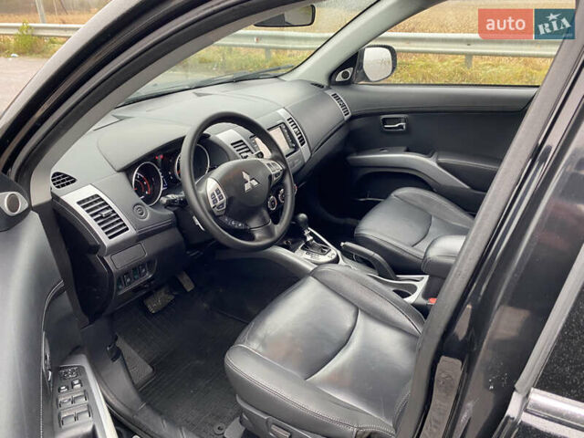 Черный Мицубиси Аутлендер, объемом двигателя 2.2 л и пробегом 227 тыс. км за 10700 $, фото 22 на Automoto.ua