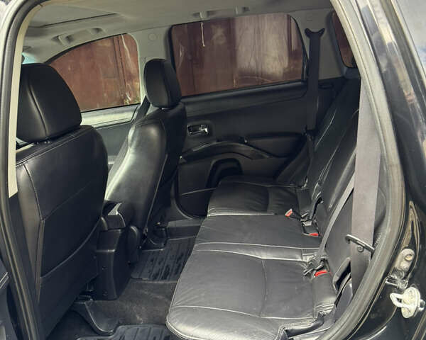 Чорний Міцубісі Аутлендер, об'ємом двигуна 2 л та пробігом 258 тис. км за 8699 $, фото 10 на Automoto.ua