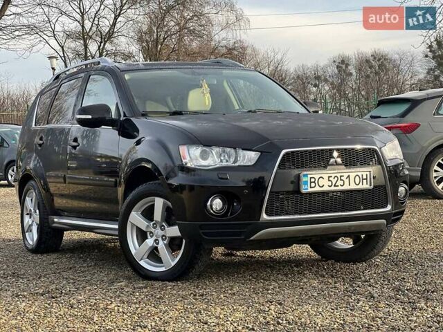 Черный Мицубиси Аутлендер, объемом двигателя 2.18 л и пробегом 249 тыс. км за 11500 $, фото 1 на Automoto.ua