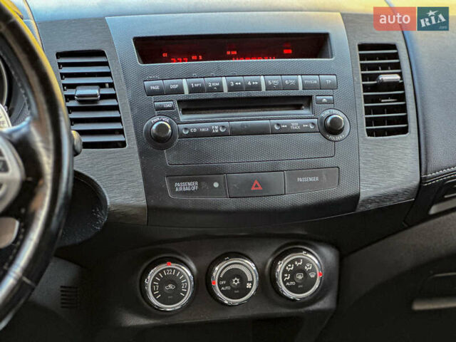 Черный Мицубиси Аутлендер, объемом двигателя 2.2 л и пробегом 226 тыс. км за 11500 $, фото 88 на Automoto.ua