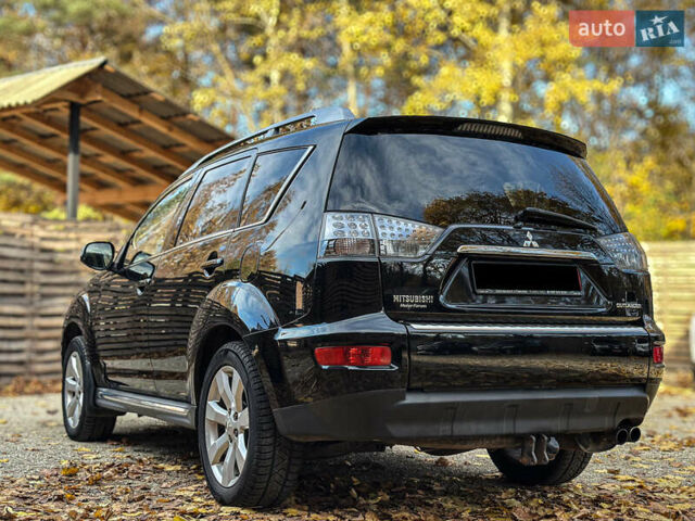 Черный Мицубиси Аутлендер, объемом двигателя 2.2 л и пробегом 226 тыс. км за 11500 $, фото 2 на Automoto.ua