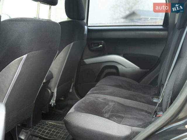 Черный Мицубиси Аутлендер, объемом двигателя 2.4 л и пробегом 184 тыс. км за 10800 $, фото 6 на Automoto.ua