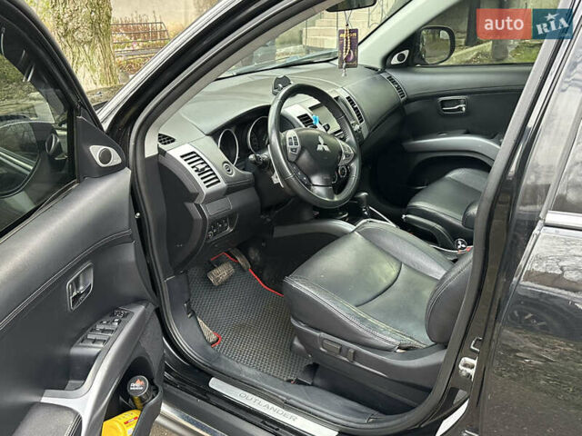 Чорний Міцубісі Аутлендер, об'ємом двигуна 2.36 л та пробігом 197 тис. км за 11300 $, фото 11 на Automoto.ua