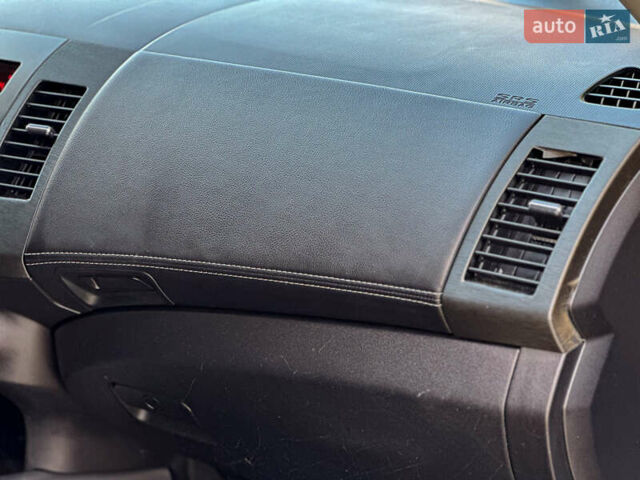 Черный Мицубиси Аутлендер, объемом двигателя 2.2 л и пробегом 226 тыс. км за 11500 $, фото 103 на Automoto.ua