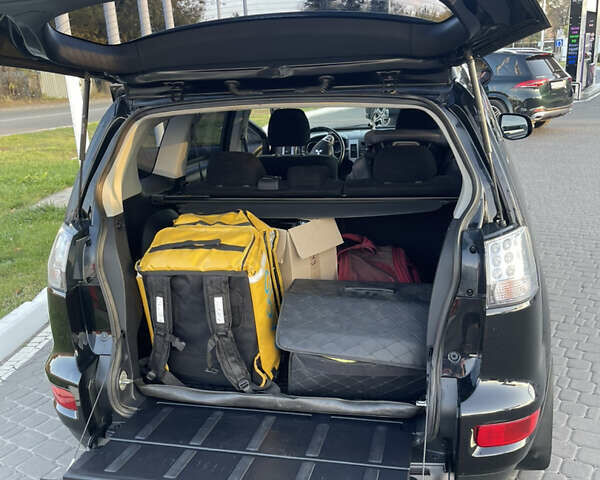 Чорний Міцубісі Аутлендер, об'ємом двигуна 2.4 л та пробігом 93 тис. км за 12500 $, фото 20 на Automoto.ua