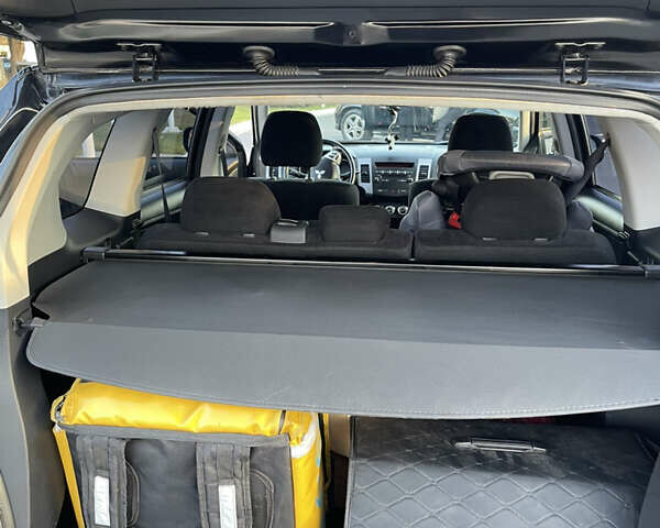 Чорний Міцубісі Аутлендер, об'ємом двигуна 2.4 л та пробігом 93 тис. км за 12500 $, фото 19 на Automoto.ua