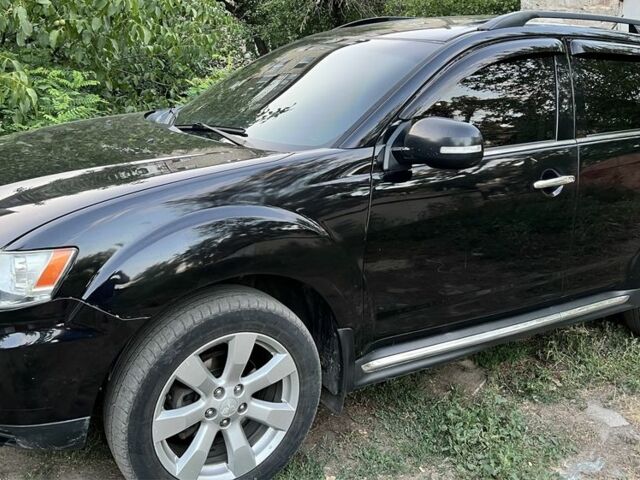 Черный Мицубиси Аутлендер, объемом двигателя 2.4 л и пробегом 220 тыс. км за 10500 $, фото 2 на Automoto.ua