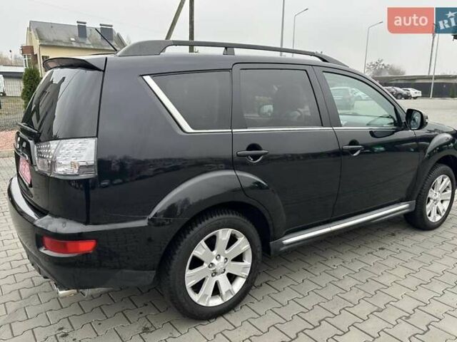 Черный Мицубиси Аутлендер, объемом двигателя 2.2 л и пробегом 226 тыс. км за 10750 $, фото 24 на Automoto.ua