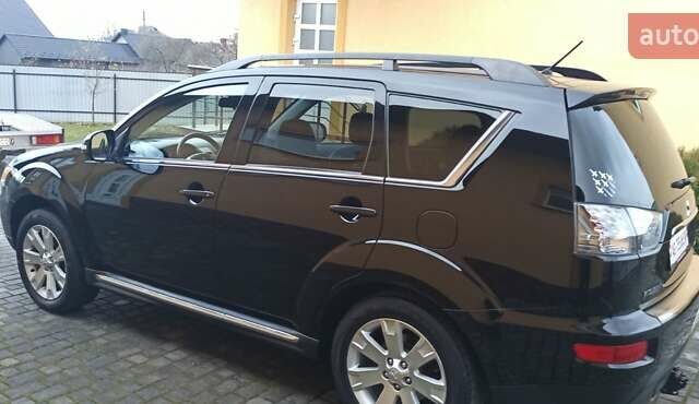 Черный Мицубиси Аутлендер, объемом двигателя 2.2 л и пробегом 209 тыс. км за 12700 $, фото 13 на Automoto.ua