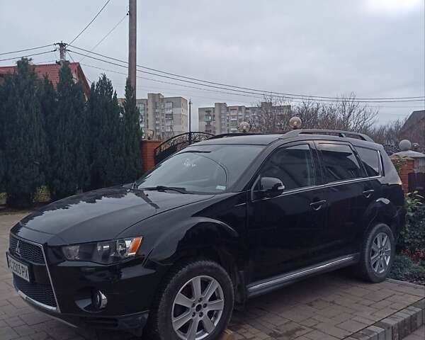Черный Мицубиси Аутлендер, объемом двигателя 2 л и пробегом 196 тыс. км за 9900 $, фото 2 на Automoto.ua