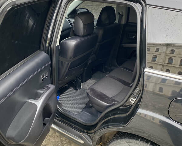 Черный Мицубиси Аутлендер, объемом двигателя 2.27 л и пробегом 233 тыс. км за 10500 $, фото 12 на Automoto.ua