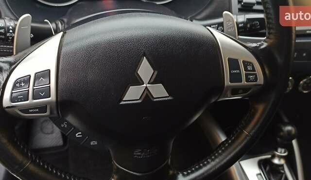 Черный Мицубиси Аутлендер, объемом двигателя 2.2 л и пробегом 209 тыс. км за 12700 $, фото 24 на Automoto.ua